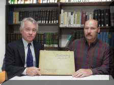 Paul Rigby and Robert Benner display the book: Shell Loading at Amatol, N.J.  