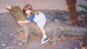 Rhiannon takes a ride on the Komodo dragon