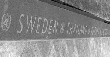 Korean War - The Walkway - A granite curb lines the path stretching toward the reflecting pool. On it are the names of the 22 nations, in alphabetical order, participating in the United Nations' effort in Korea. The names of the countries, beginning with Australia and ending with the United States, are separated by the U.N. symbol. The walkway completes the "Field of Service" - the triangular area on which the wall and 19 statues stand.