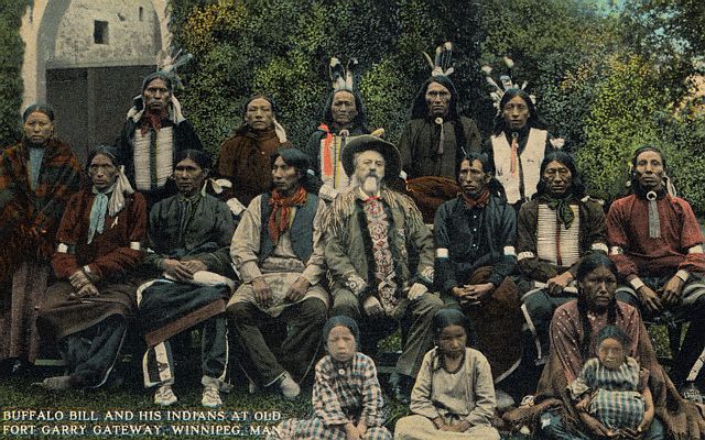 Native Americans - William Frederick Cody, (1846-1917) known as Buffalo Bill, American scout and showman, at Fort Garry Gateway, Winnipeg, Manitoba, Canada with Native Americans.