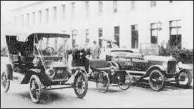 Henry ford with first and last Model T and a quadricycle.